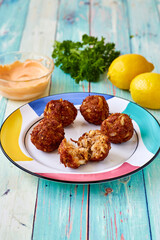 fried crab 'balls' served with fresh lemon and parsley with a spicy remoulade dipping sauce