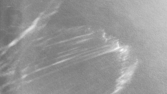 Sunlight casting on a white paper surface trough clear glass. Light refraction, dispersion of light, realistic shadows, 4k UHD, 16:9 ratio. For overlay, multiply, screen Blend Modes for mockups.