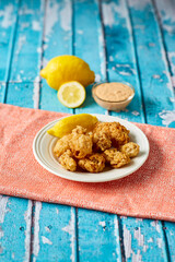 crispy fried oysters served with fresh lemon and a remoulade