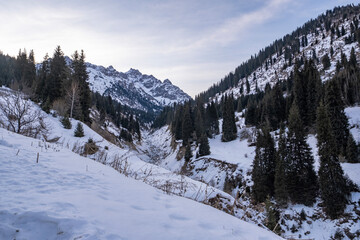 Winter landscape in the mountains not far from Almaty, Maloalmatinskoe gorge in winter. Snow and mountains, popular tourist route.