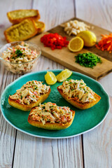 spicy crab salad served on toasted garlic bread