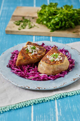 wasabi seared ahi tuna served on a red cabbage coleslaw