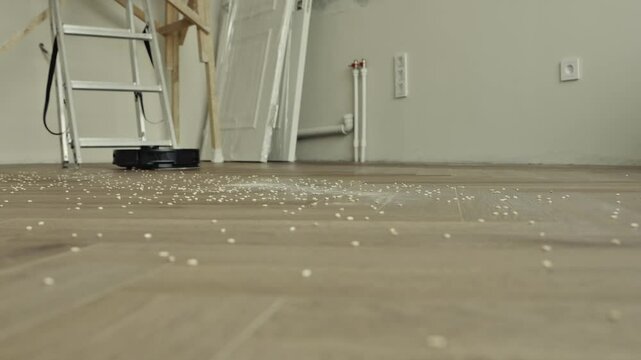 Robot vacuum cleaner vacuuming the floor in the bedroom. Smart home with automated devices that simplify life. A smart vacuum cleaner cleans the floor. High quality 4k footage