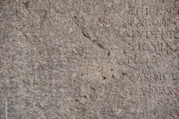 Ancient stone wall background with antique text