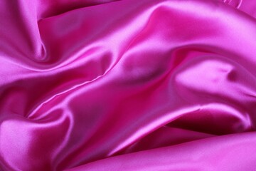 Smooth elegant pink satin texture can use as background. Luxurious background design