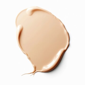 CC cream smear with beige skin tone on white. Cosmetic liquid foundation smudge stroke for beauty make-up. Face care sample, makeup tonal shade collection flat lay texture.