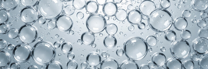 Transparent bubbles floating in clear liquid
