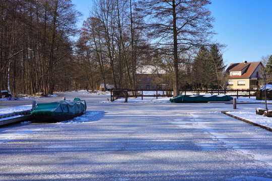 Winter landscape, frozen stream in Schlepzig in the Spreewald (Spree forest), Germany 