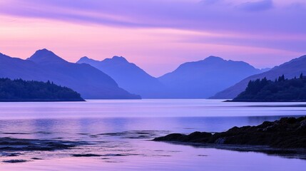 Serene Sunset Over Purple Mountains and Calm Water