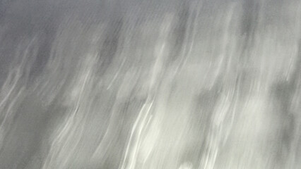 A blurred background enhances focus on the main subject by creating a smooth, out-of-focus effect.