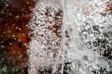 Ice texture with cracks, bubbles and frozen leaves for computer graphics, texturing, compositing or as a background