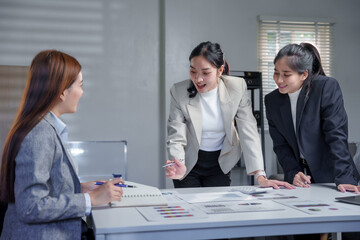Businesswomen Collaborating on Creative Project in Office