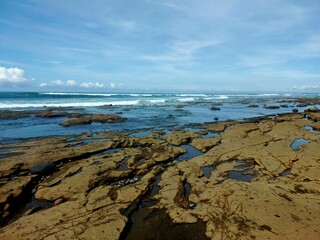 Enjoying the ocean view at Yeh Leh beach, Bali.