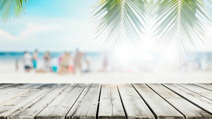 Empty wooden table and palm leaves with party on beach blurred background in summer time.
