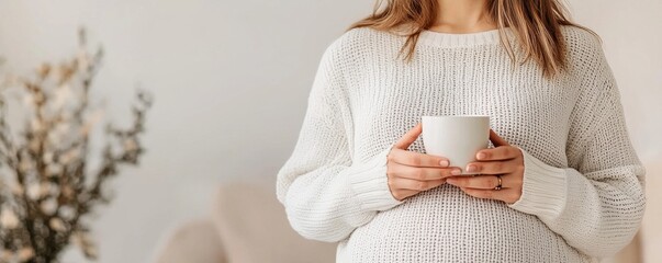 Pregnant woman sipping herbal tea at home relaxing in nature maternity health and guidance
