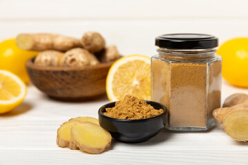Fresh ginger on wooden background. Dry ginger. Sliced ​​ginger with honey and lemon. Ginger root. Traditional alternative medicine, healing tea for immunity. Seasoning and spices concept. Copy space.