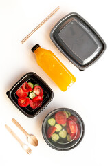 Tomatoes salad in plastic delivery tray, top view. Catering concept