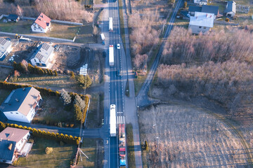 Transport truck driving on road through scenic landscape