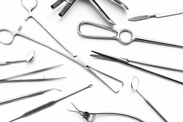 Flat lay of surgical stainless metal hand tools. Professional medical equipment and instruments