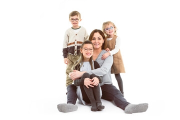mother and her daughters portrait isolated on white studio.