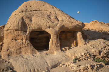 Rock Formation with Stone Window in Raqmu. Beautiful Sunny Stony Landscape in Petra. 