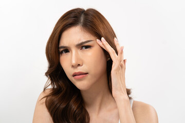 Naklejka premium Asian woman concern in skincare with wavy hair against a plain white background