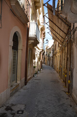 Naklejka premium charming narrow street in Syracuse, Sicily