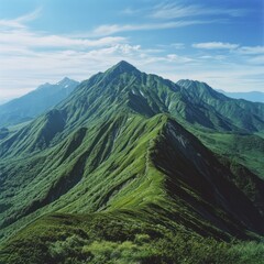 Majestic Green Mountains Under a Clear Blue Sky