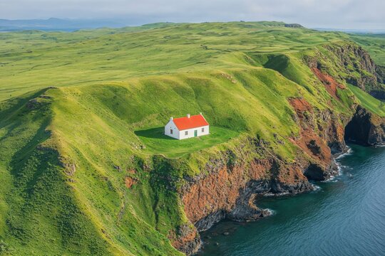 Coastal Cottage in Lush Green Cliffs Overlooking Azure Waters