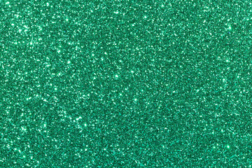 Fototapeta premium A green background with glittery specks