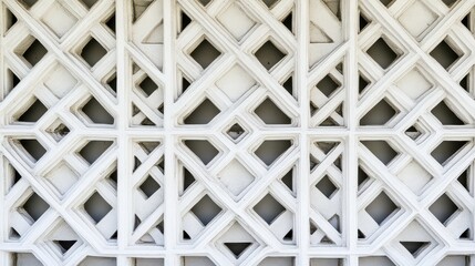 Naklejka premium Intricate White Geometric Pattern on Wall with Repetitive Design Elements in Modern Architecture for Background or Texture Use