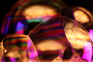 Green and purple coloured liquid surface, bright light, liquid motion, bubbles background, bubbles connection, phenomenal abstraction, perfect glossy shapes, beautiful science