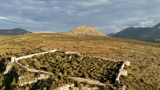 Aerial shot of entire Kelefa Castle near Oitylo sea bay at sunset, Mani, Laconia, Greece.