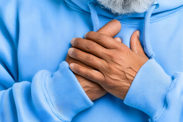 Senior man chest pain, holding hands on chest. Possible use Stock photo for medical articles, or health-related articles