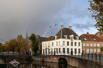 canal in amersfoort with birds and rainbow