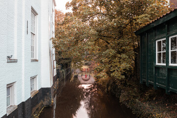 Amersfoort, a narrow canal in old town in autumn
