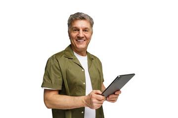 Mature man with gray hair smiles while holding a tablet in a bright, minimalistic setting