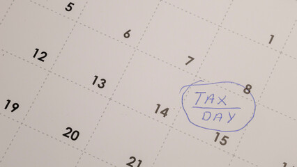 Tax day reminder on a calendar. Planning finances and marking important dates for tax preparation. Get ready for filing taxes! #TaxDay #CalendarReminder