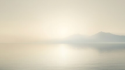 Serene Sunset Over Misty Mountains And Calm Water