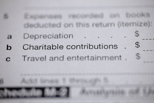 Tax form showing potential deductions, including charitable contributions and travel and entertainment. Finance and accounting form showing expenses.