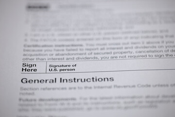 Fototapeta premium Document with signature instructions: A close-up shot of a form section with the words 