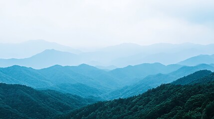 Serene Blue Mountains Landscape Under Hazy Sky