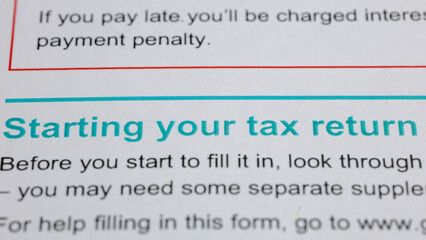 Starting your tax return: A close-up view of instructions for completing a tax form, highlighting...