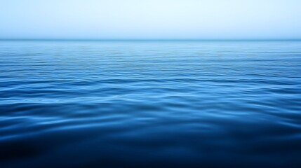 Obraz premium Serene Blue Ocean Water Surface Showing Gentle Waves