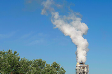 Pollution emissions going up in the sky from the industrial site