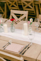 Elegant dining setup with floral decor for a special occasion in a rustic venue