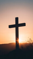 Sunlight streaming behind a cross on a hill during sunset, creating a striking silhouette against the vibrant evening sky