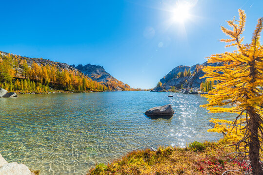 Beautiful Alpine Lake With Autumn Larches
