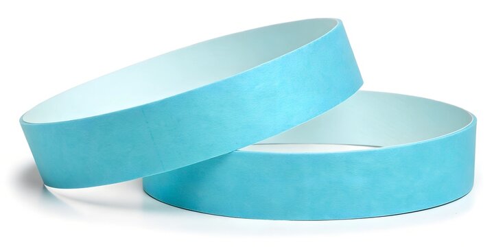 A close-up mockup of blank blue paper wristbands, slightly stacked against a white background. Ideal for event branding, ticketing, and wristband design concepts.