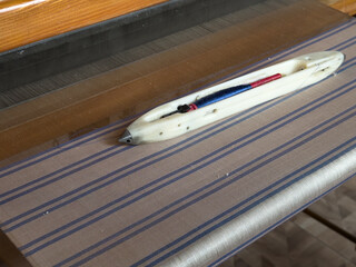 Weaving, traditional crafts,Close-up of a loom weaving, Woven silk,using cotton and silk string...